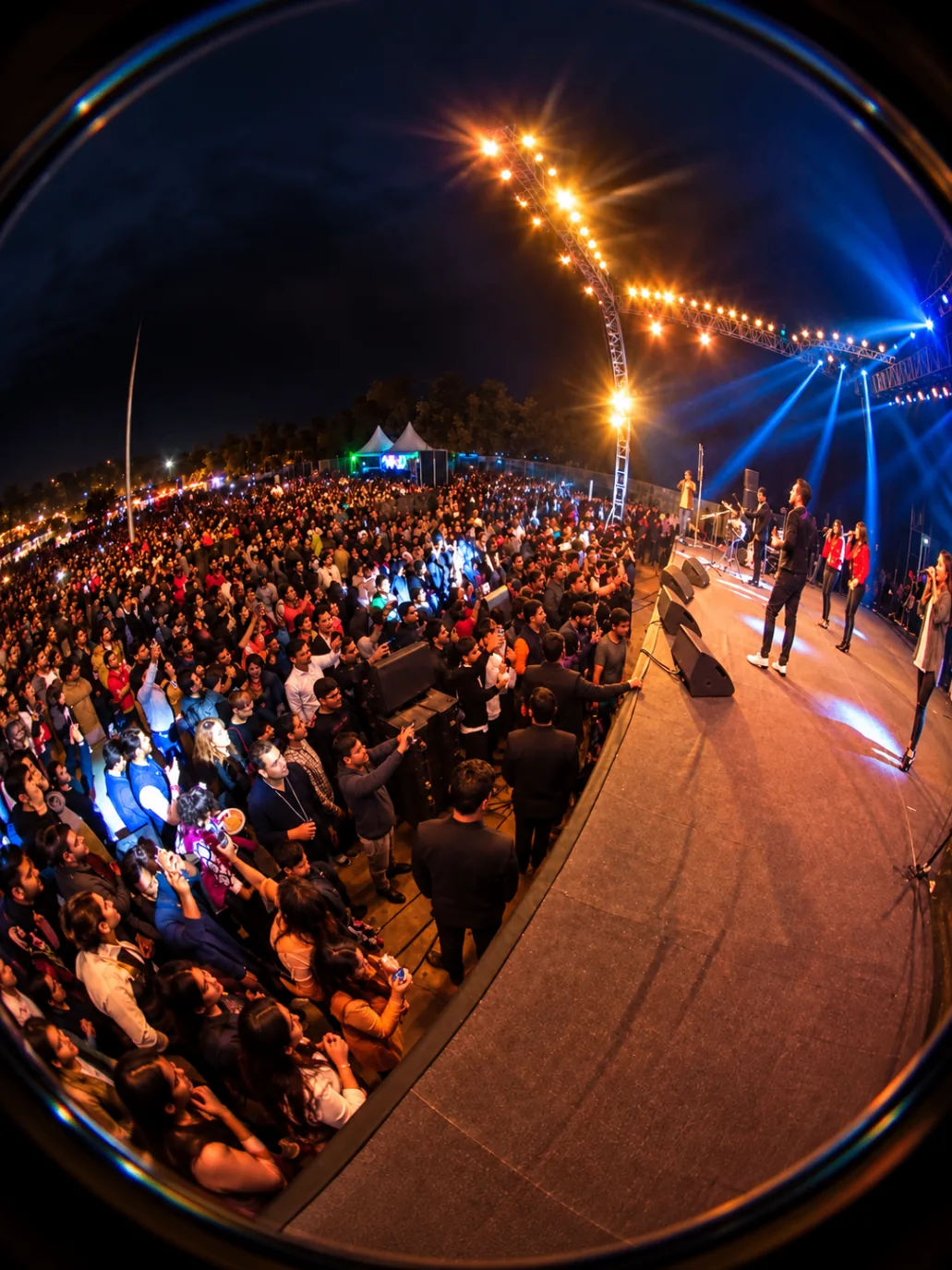 View from the stage over a live concert audience at a The Kabir Company event